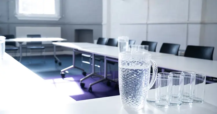 Chapel room with horseshoe set up and water jug