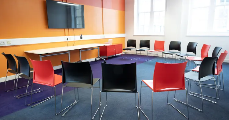 Nest set up with 15 chairs in a circle