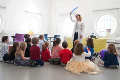 Entertainer with children in the Angel Room