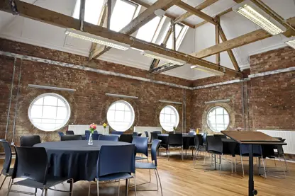 Cabaret style set up with black tablecloths